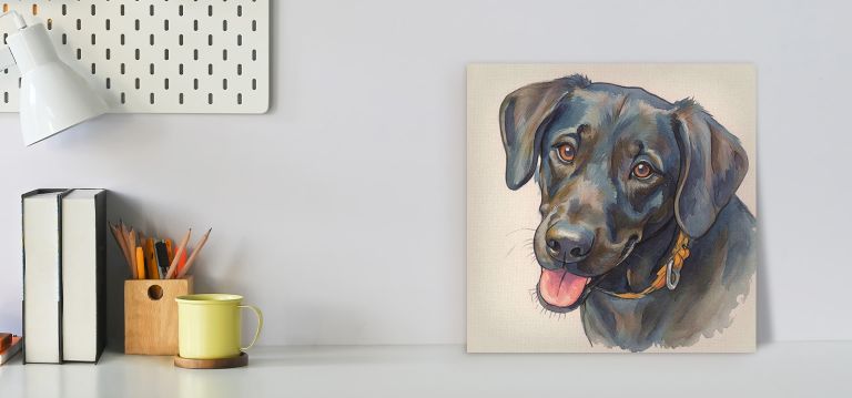 Colorful painting of a black Labrador with a yellow collar on a desk.