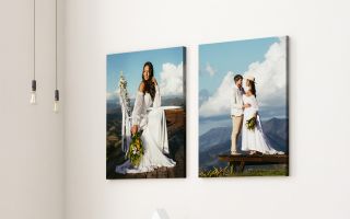 Framed wedding portraits on a wall, featuring a bride and a couple in a scenic mountain setting.