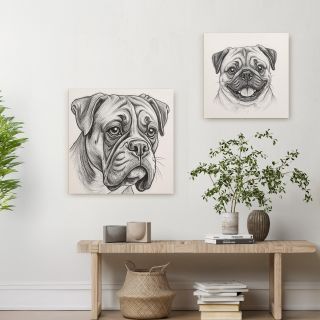 Framed pencil sketches of two dogs on a white wall