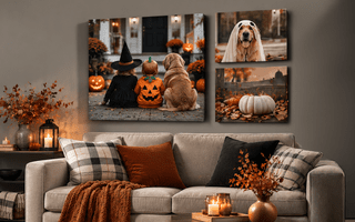3 halloween themed canvas prints on a wall with a sofa decorated for the fall season.